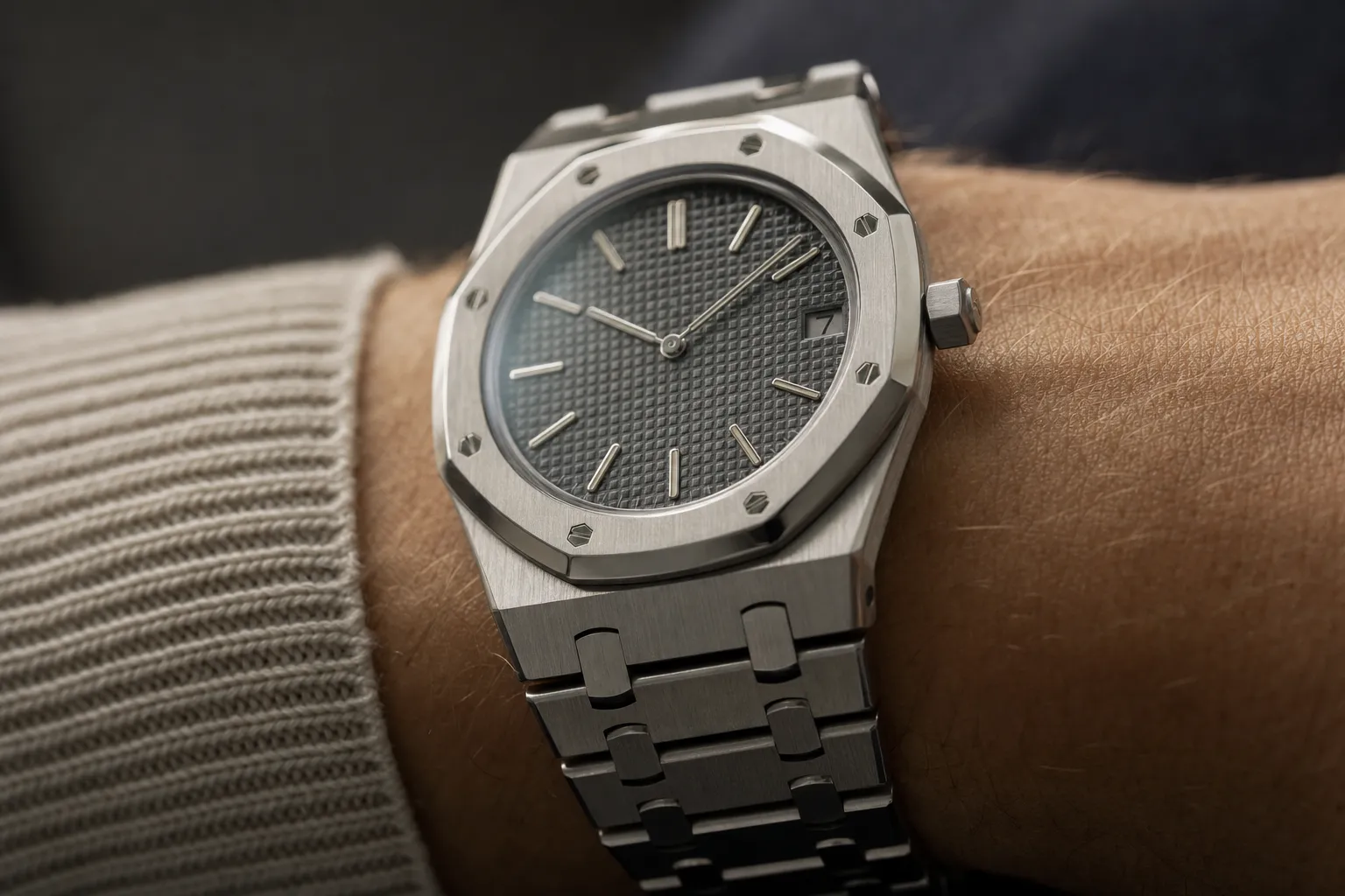 Iconic Audemars Piguet Royal Oak Jumbo Extra-Thin in stainless steel on a wrist, emphasizing its Genta-designed octagonal bezel, integrated bracelet, and 'Tapisserie' dial