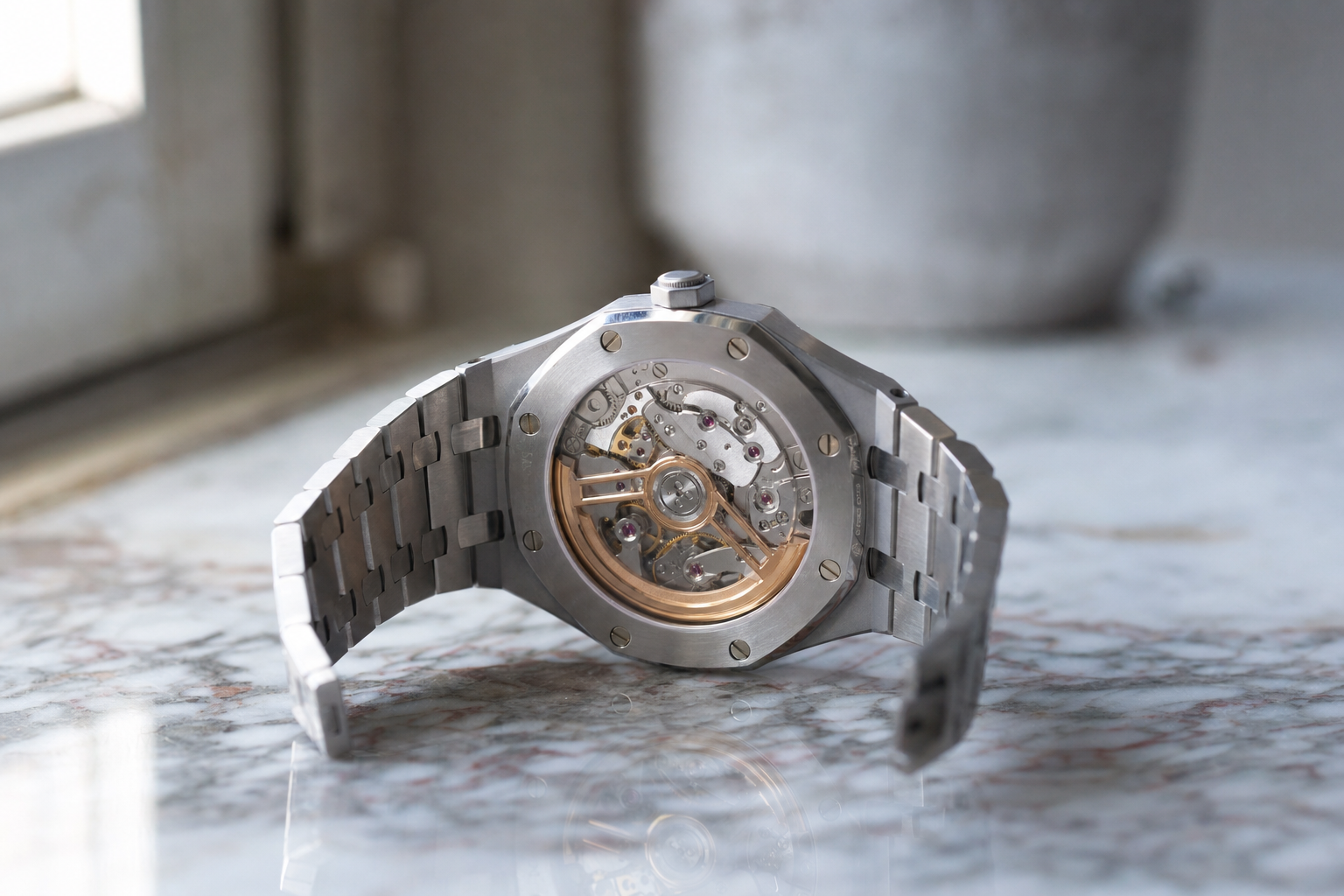 Detailed view of the Audemars Piguet Caliber 4302 movement in a Royal Oak 15510ST, highlighting the 22K gold rotor and Geneva stripes.