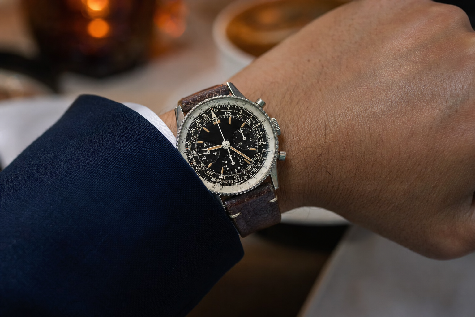 Vintage Breitling Navitimer 806, black dial, beaded bezel, and intricate slide rule, highlighting aviation heritage.