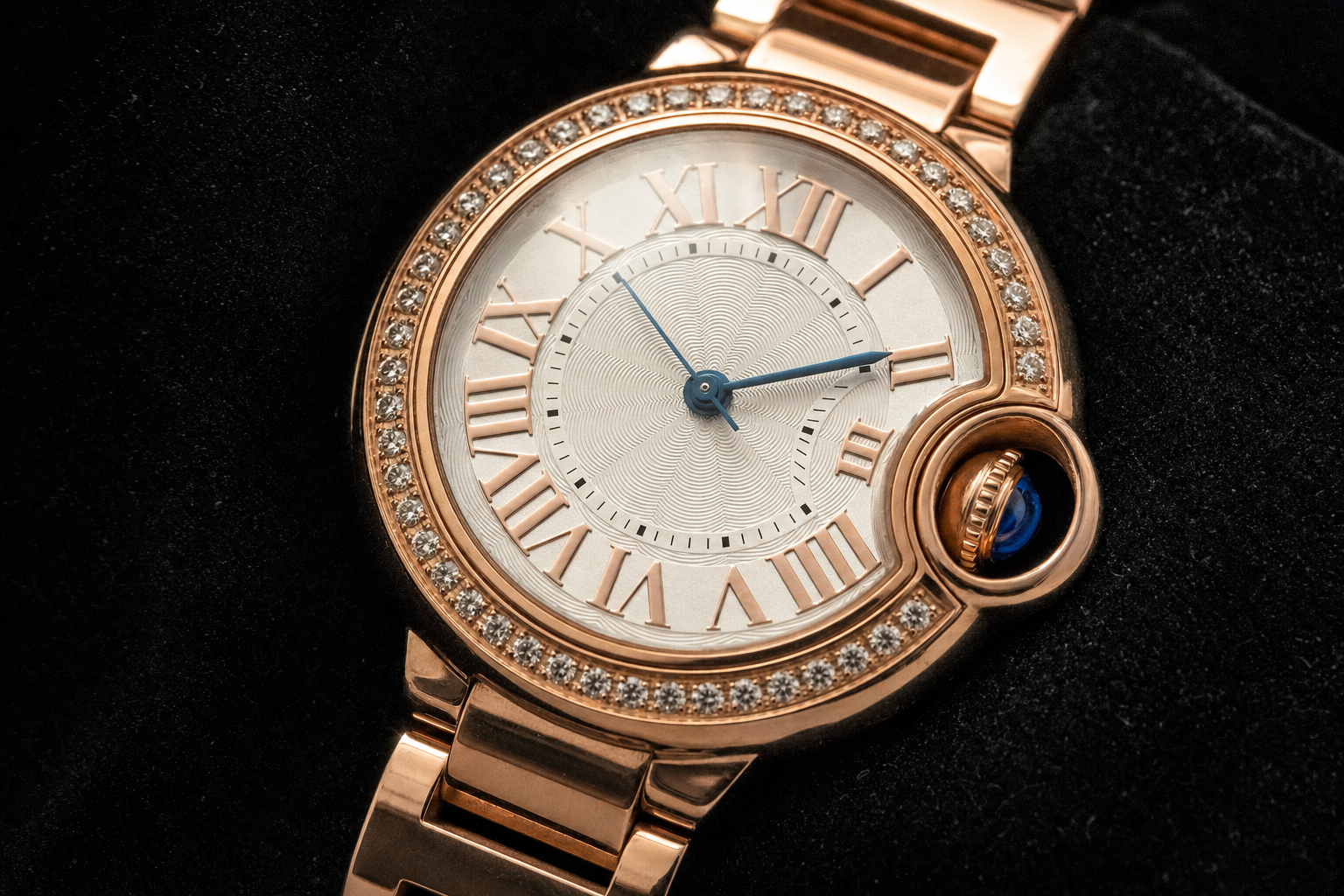 Stunning Cartier Ballon Bleu 33mm in rose gold with diamond bezel, iconic blue cabochon, and silver guilloché dial on matching bracelet.