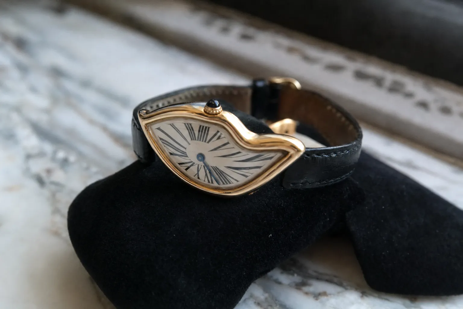 Vintage 18k yellow gold Cartier Crash watch Paris edition with distorted Roman numeral dial on velvet