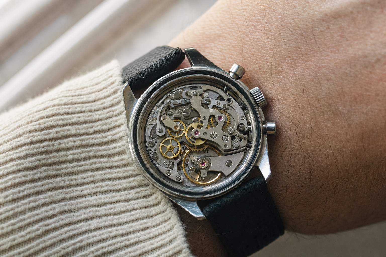 Mechanical cam-actuated chronograph movement with visible cam system and pushers for stop, start, and reset functions