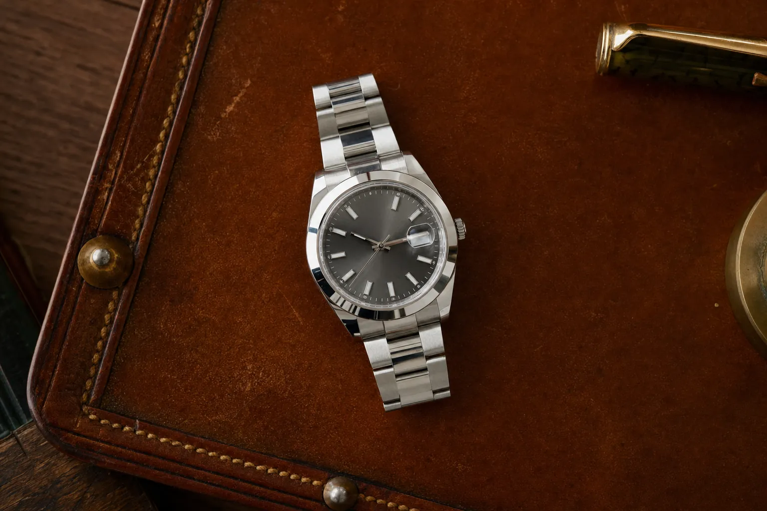 Close-up of a stainless steel Rolex Datejust in excellent condition, showcasing its pristine polished bezel, brushed case, and clean dial with minimal wear.