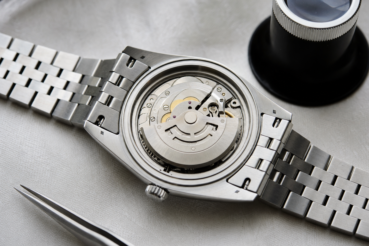 Detailed view of a Rolex Datejust 41mm blue dial, fluted bezel, Jubilee bracelet, highlighting the date window magnification.