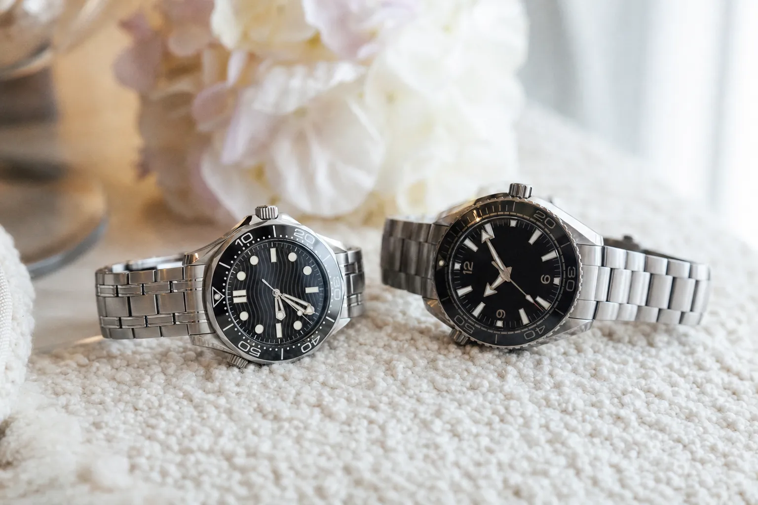 Omega Seamaster Diver 300M next to Planet Ocean 600M steel watches comparison